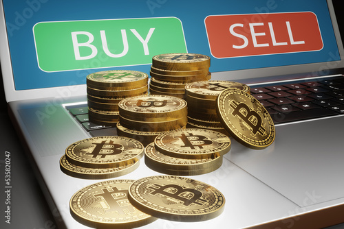 Stacks of Bitcoins on a laptop which is showing the Buy and Sell button. Illustration of the concept of cryptocurrency trading photo