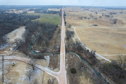 An aerial shot of a rural dirt road in Oklahoma photo