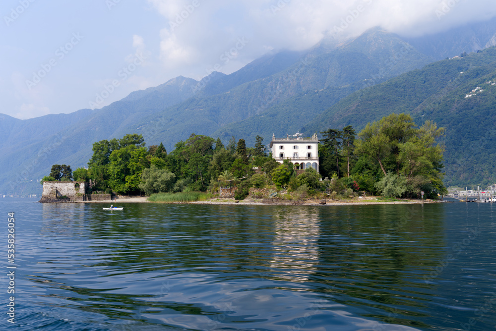 Fototapeta premium Beautiful Brisago Islands seen from passenger ship on a sunny summer day. Photo taken July 25th, 2022, Brisago Islands, Switzerland.