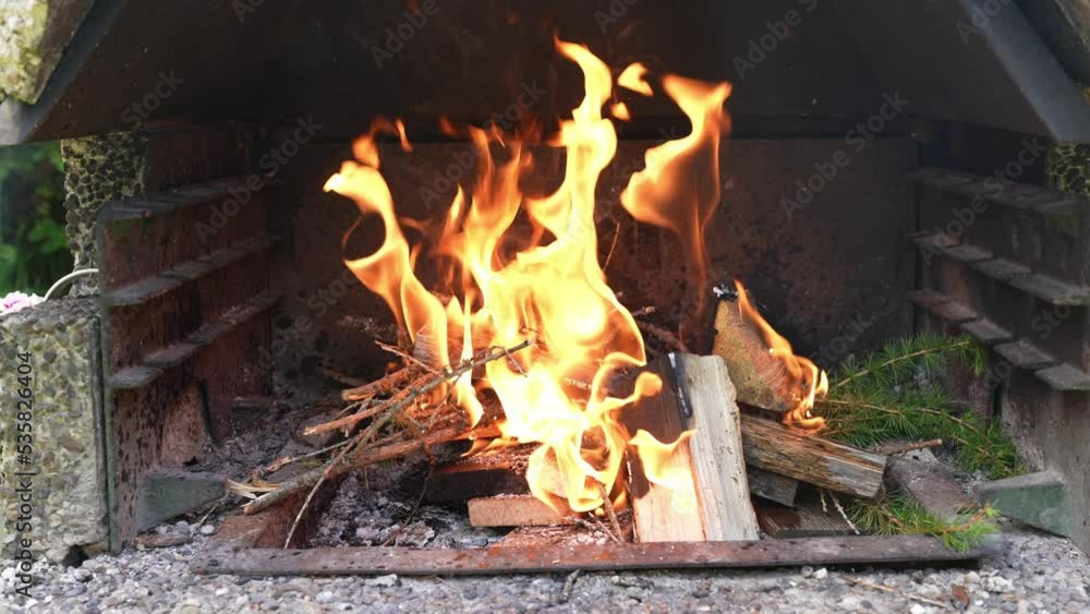 Methylated spirits are poured into the small fire in the charcoal grill and the flames immediately become larger. Dangerous fire Methylated spirits are poured into the small fire in the charcoal grill and the flames immediately become larger. Dangerous fire