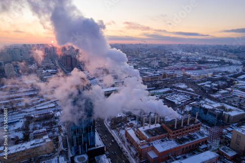 Smoke comes out of the heat boiler pipe. Central heating system of apartment buildings.