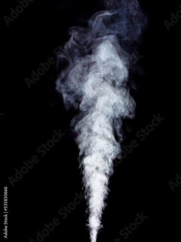 White smoke steam rising up on black