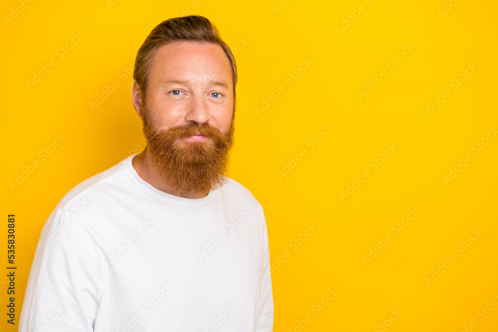 Photo of satisfied calm young person empty space ad blank isolated on yellow color background Photo of satisfied calm young person empty space ad blank isolated on yellow color background