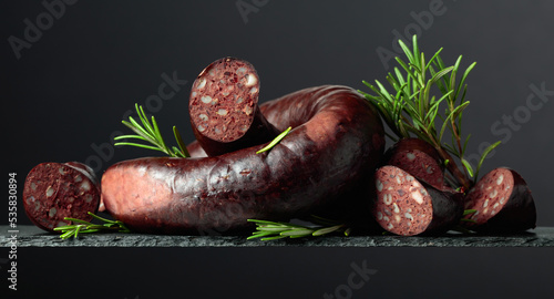 Spanish black pudding or blood sausage with rosemary. photo