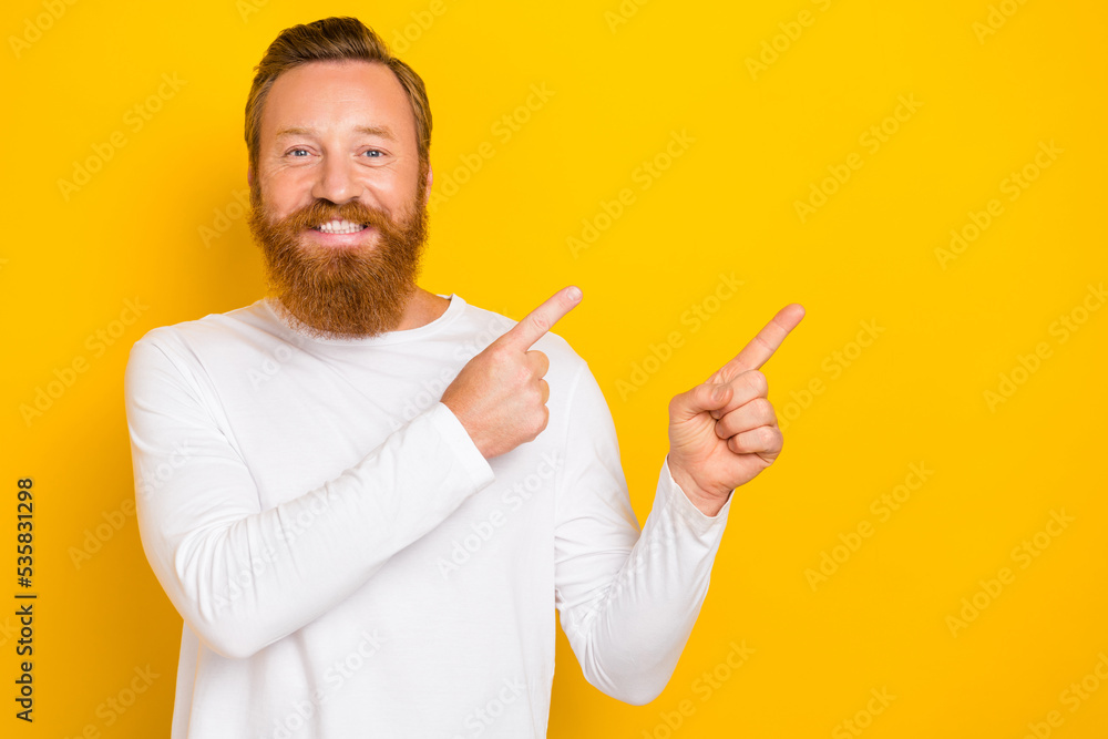Closeup photo of young handsome redhair experienced man recommend directing empty space professional app isolated on yellow color background Closeup photo of young handsome redhair experienced man recommend directing empty space professional app isolated on yellow color background