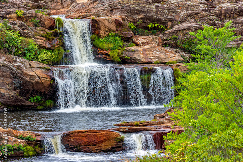 Beautiful and small waterfall among the rocks and vegetation of the Biribiri environmental reserve in Diamantina, Minas Gerais.