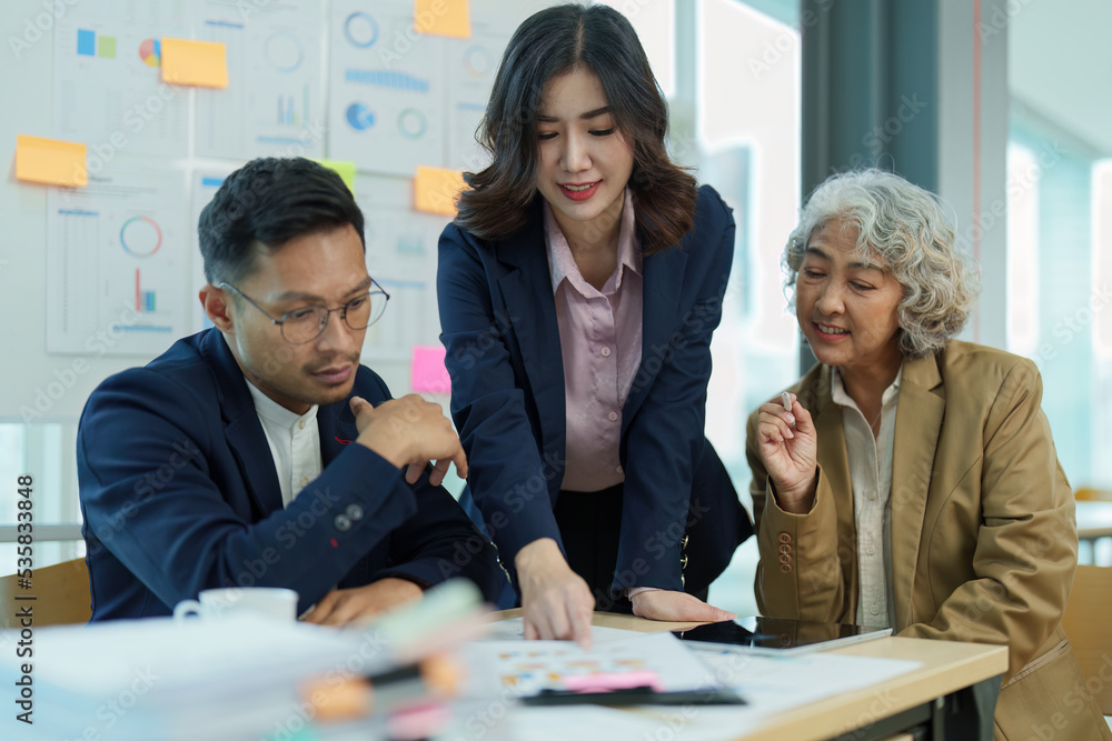 Fototapeta premium Asian entrepreneurs and business people meeting in a conference room in business planning, financial budget and investment risk assessment to analyze customer groups to increase company growth