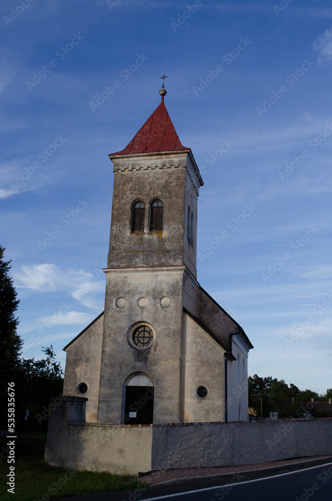 old Bohemian country church with blue sky background