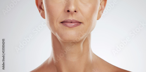 Woman  lips and mature in zoom of mouth for cosmetics  beauty and health. Model  face and skin in dermatology portrait of wellness  facial and skincare in cosmetic closeup against studio background