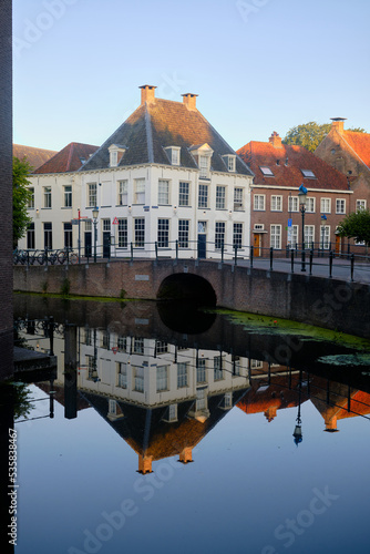 Amersfoort, The Netherlands, August 9, 2022. Westsingel and Kleine Spui in the old city centre. Reflections in the canal. photo