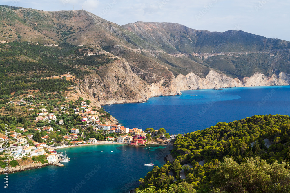 Fantastic top view at Asos village, Assos peninsula and blue Ionian Sea water. Aerial view, summer scenery of famous and extremely popular travel destination in Cephalonia, Greece, Europe