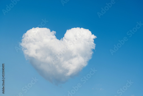 White heart shaped cloud in the blue sky