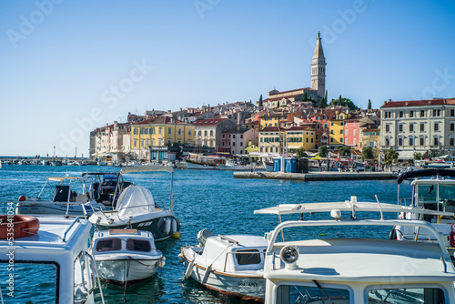 colorful houses in the old town of Rijeka with the sea and boats in the port in the foreground photo