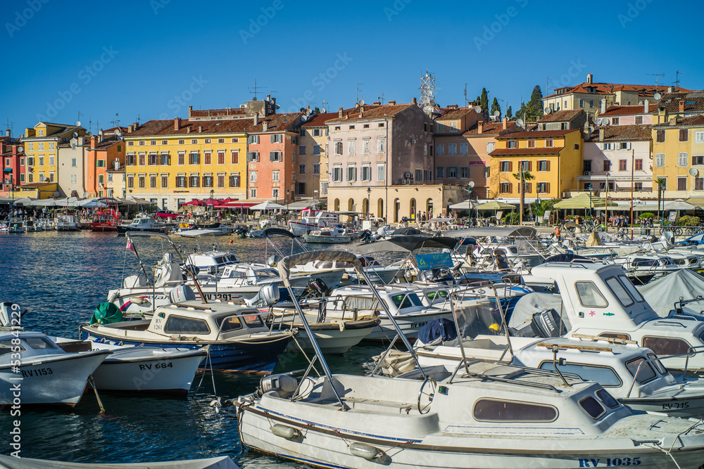 colorful houses in the old town of Rijeka with the sea and boats in the port in the foreground