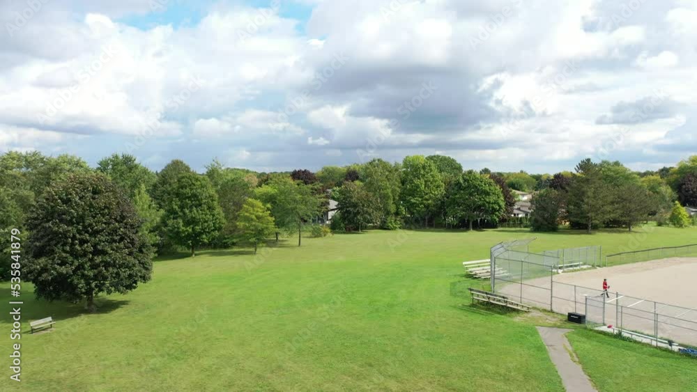 Sunny sky view of the suburbs from park Sunny sky view of the suburbs from park