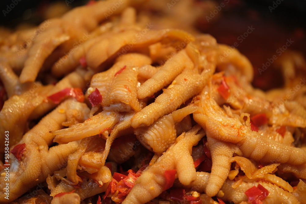 close up spicy chicken feet background. Traditional Chinese food close up spicy chicken feet background. Traditional Chinese food