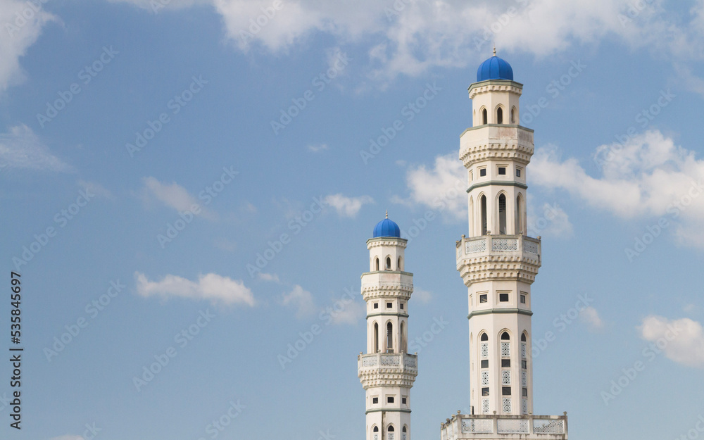 Minarets with a blue sky and clouds