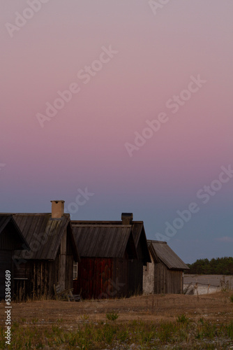 Twilight with earth shadow over fishing cabins at Helgumannen fishing village on Fårö, Gotland 