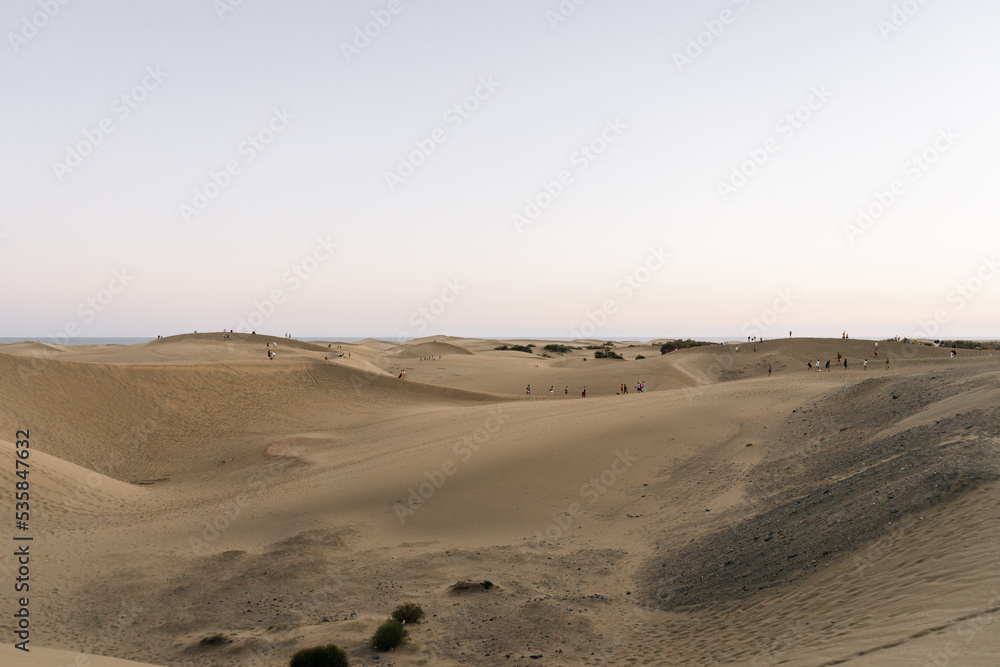 Dunes full of tourists on the Maspalomas beach in Gran Canaria Dunes full of tourists on the Maspalomas beach in Gran Canaria