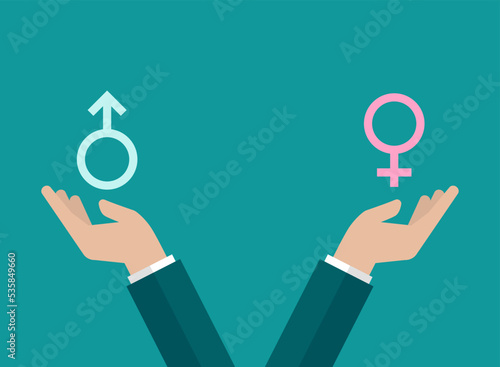 Gender and sexual equality concept. Businessman hands hold male and female sex symbols. Balance between man and woman. Fair comparison concept.