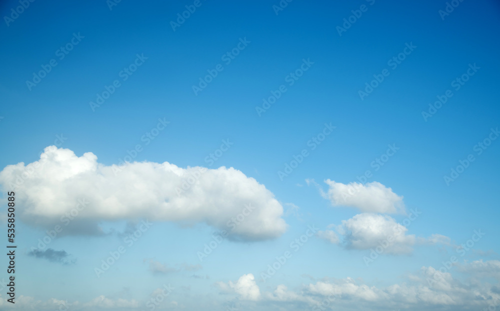 White fluffy clouds in blue sky