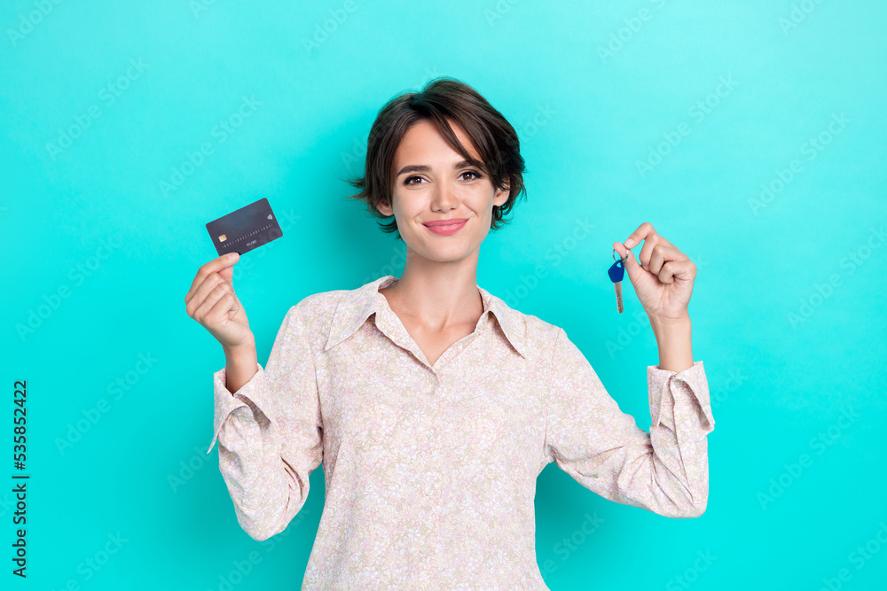 Photo of charming customer lady stylish outfit arm hold key plastic card new flat good choice ownership isolated on cyan color background Photo of charming customer lady stylish outfit arm hold key plastic card new flat good choice ownership isolated on cyan color background