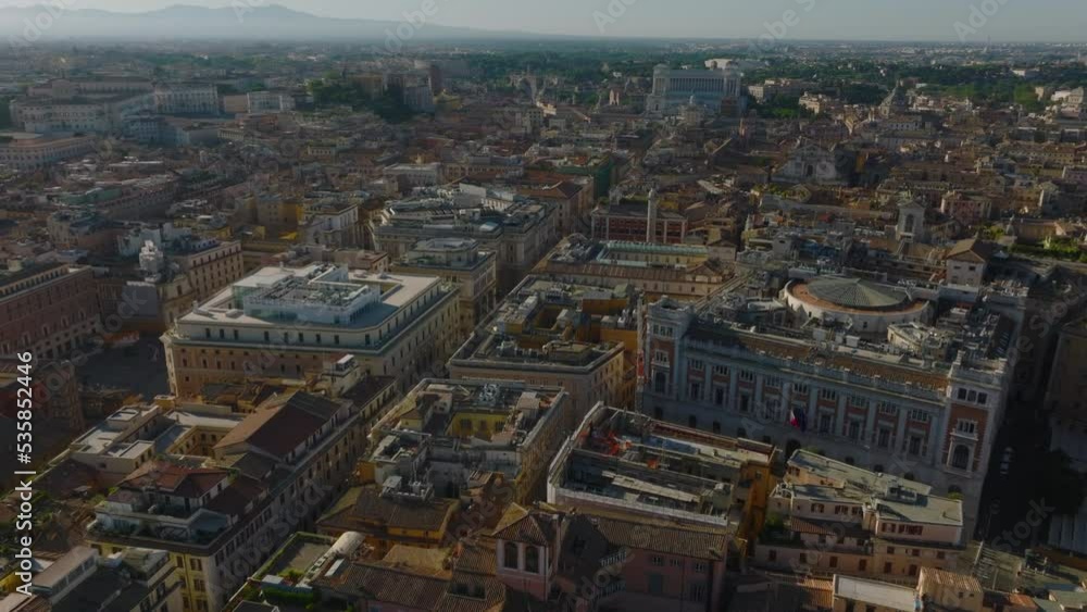 Aerial view of old buildings in historic urban borough. Forwards fly above Palazzo Montecitorio, Italian parliament building. Rome, Italy Aerial view of old buildings in historic urban borough. Forwards fly above Palazzo Montecitorio, Italian parliament building. Rome, Italy