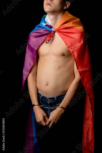 A Shirtless 19 Year Old Teenage Boy wrapped in A Pride Flag