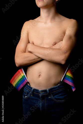A Shirtless 19 Year Old Teenage Boy with Pride Flags