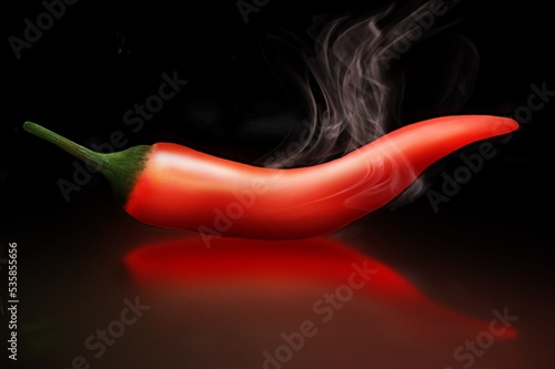 Guindilla roja sobre fondo negro, picante. Red chili pepper on black background, spicy. photo
