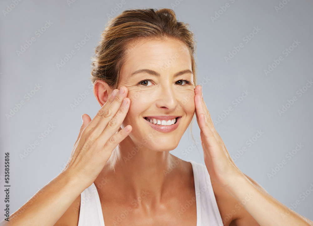 Face wellness, skincare and mature woman with smile for healthy skincare against a grey mockup studio background. Portrait of happy model with facial skin beauty and cosmetics for healthcare Face wellness, skincare and mature woman with smile for healthy skincare against a grey mockup studio background. Portrait of happy model with facial skin beauty and cosmetics for healthcare