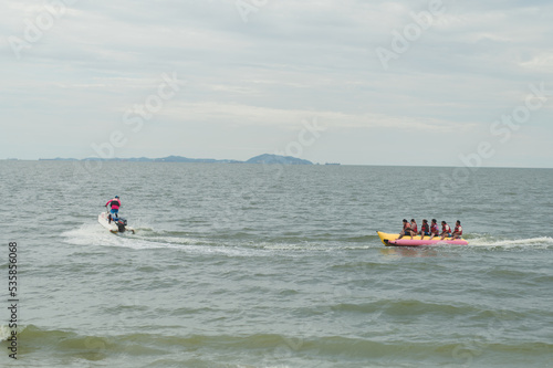 Atmosphere at Bang Saen Beach Tourists come to relax, ride bicycles, see coconut trees all over the beach, Bang Saen Beach, Chonburi Province, Thailand.