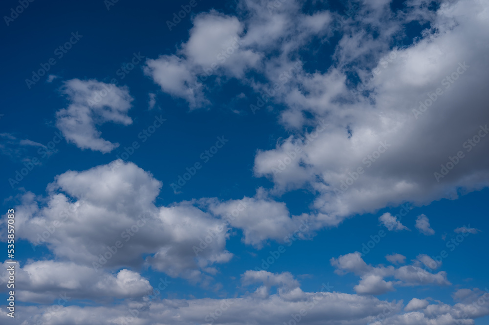 Cumulus clouds against the blue sky on a summer day. Cumulus clouds against the blue sky on a summer day.