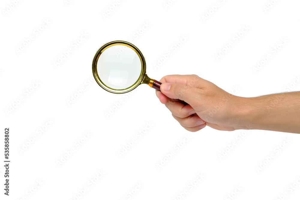 Hand holds magnifying glass, an isolate on white background. Hand holds magnifying glass, an isolate on white background.
