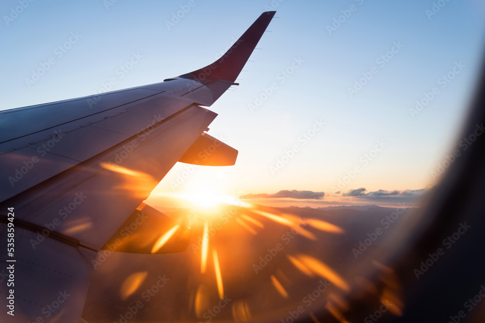 Looking at the sunset through the airplane window Looking at the sunset through the airplane window