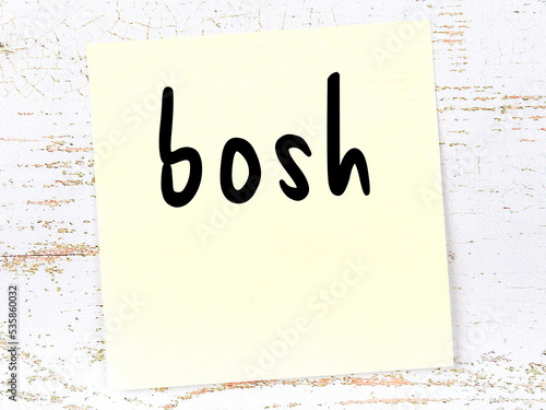 Yellow sheet of paper with word bosh. Reminder concept photo