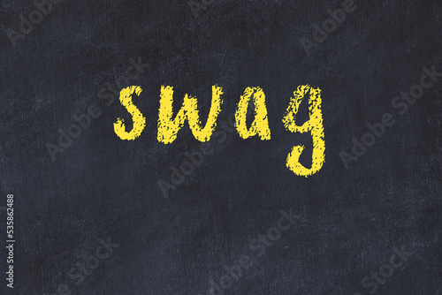 College chalk desk with the word swag written on in