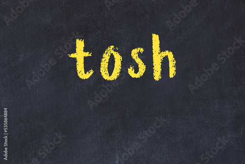 Black chalkboard with inscription tosh on in