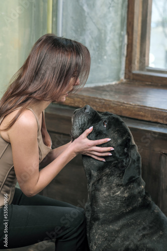 Young slender cute girl with a dog