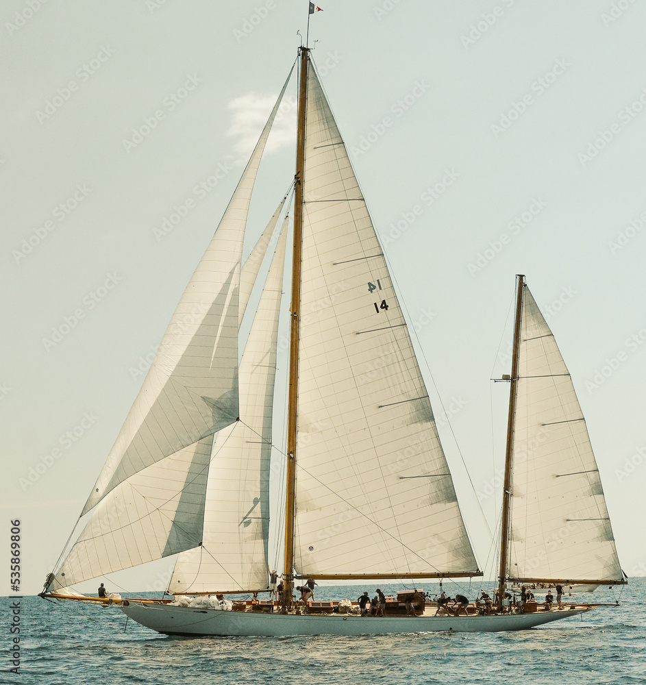Classic sailboat in French regatta with sails full of wind
