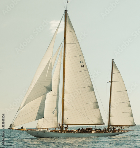 Classic sailboat in French regatta with sails full of wind
