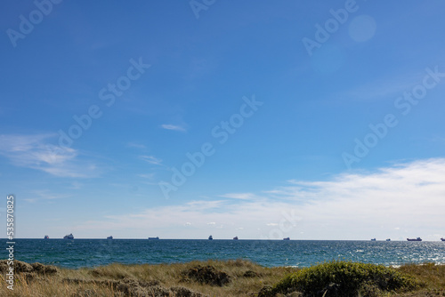 Ships waiting for loading unloading orders outside Skagen harbour Skagens Odde  English Scaw Spit or The Skaw is a sandy peninsula the northernmost area of Vendsyssel in Jutland  Denmark. Europe