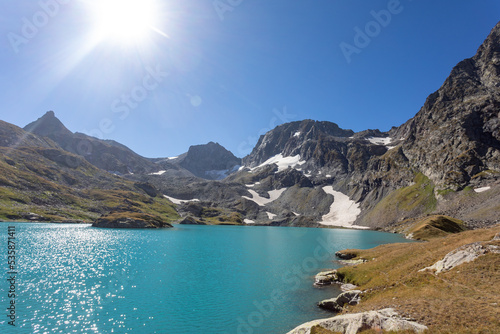 Fototapeta Naklejka Na Ścianę i Meble -  View of a blue mountain lake in the Caucasus Russia against the background of impressive steep mountain peaks
