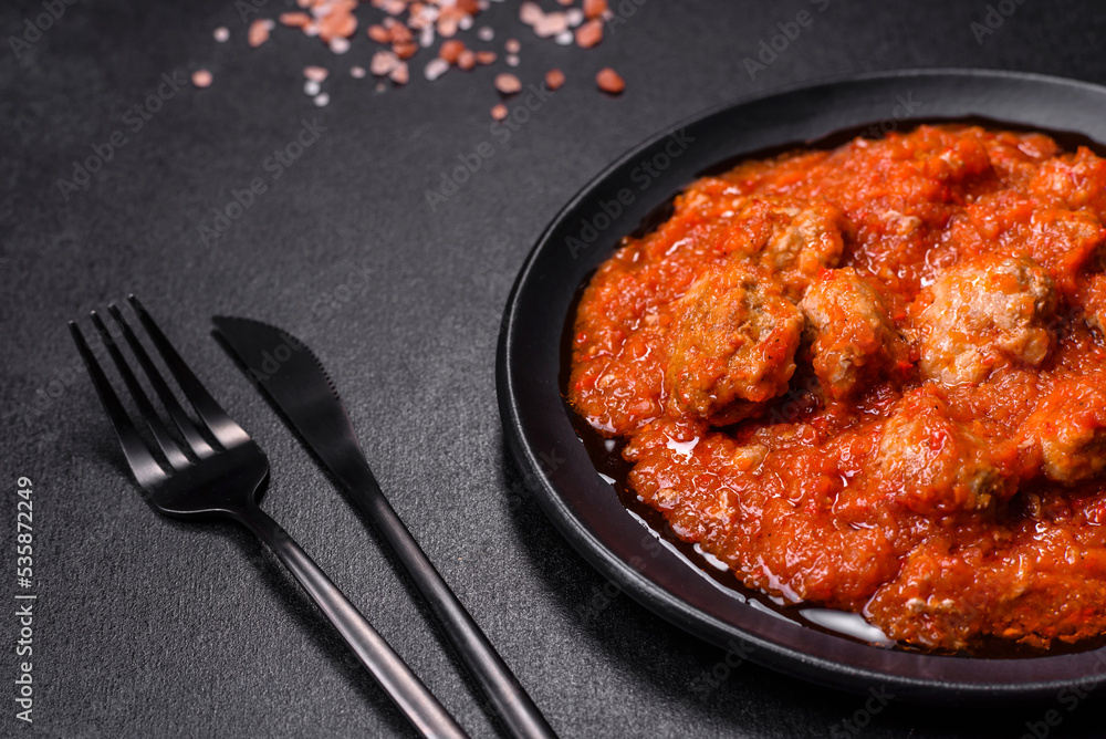 Delicious meatballs made from ground beef in a spicy tomato sauce Delicious meatballs made from ground beef in a spicy tomato sauce