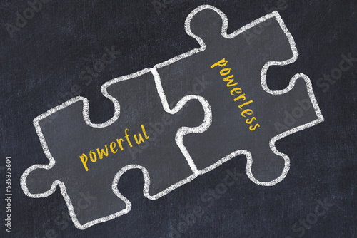 Concept of dealing with troubles. Chalk sketch of connecting puzzles with words powerful and powerless