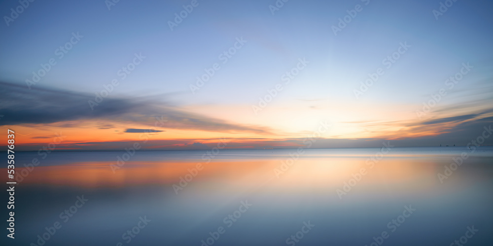 Calm colored sea and sky at sunset - obrazy, fototapety, plakaty 