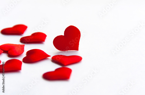 Red heart shapes on white background customizable with space for text. Copy space and love concept