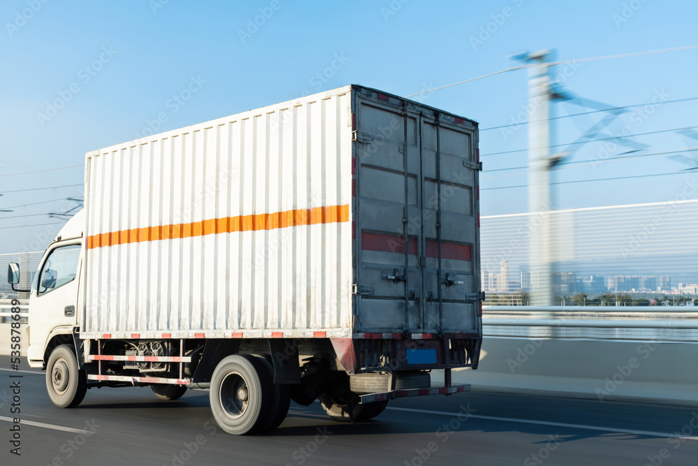 White truck driving on road