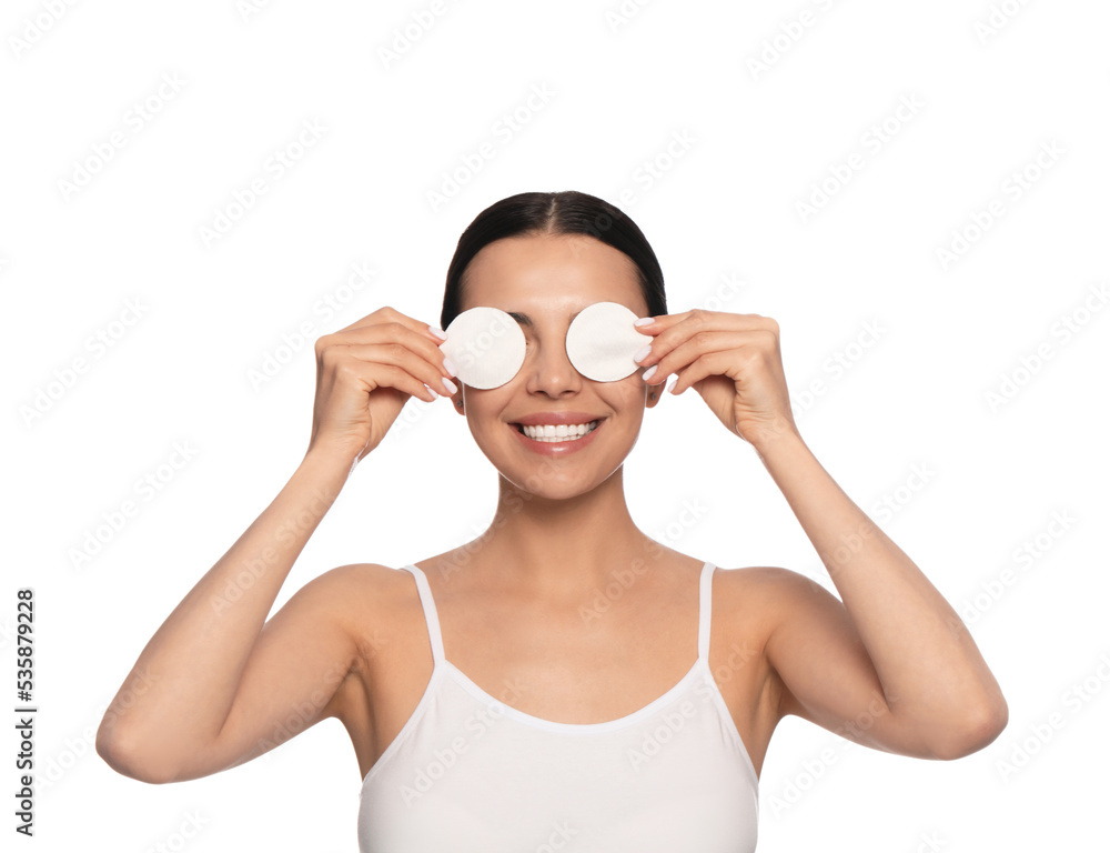Young woman using cotton pads with micellar water on white background Young woman using cotton pads with micellar water on white background