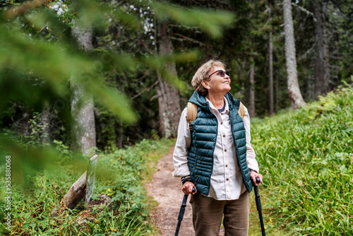 Photography Active happy mature senior woman walking in beautiful autumn forest